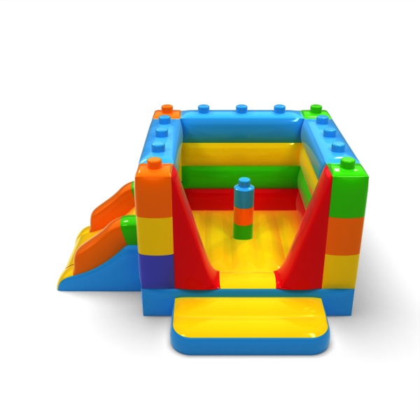 Petit château gonflable fermé avec toboggan - sur le thème des blocs colorés