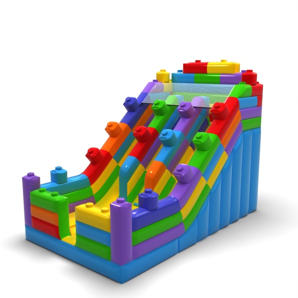 Double toboggan gonflable sur le thème de blocs colorés