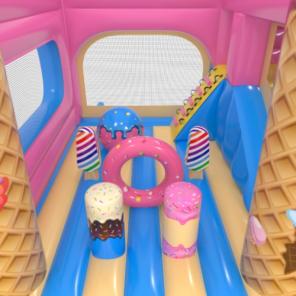 Gonflable avec toboggan combo sur le thème des bonbons